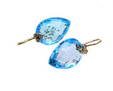 Blue topaz earrings .